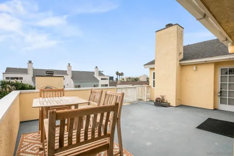 a view of a balcony with furniture