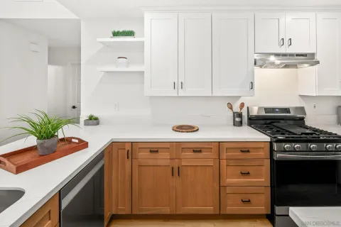 a kitchen with a sink and cabinets