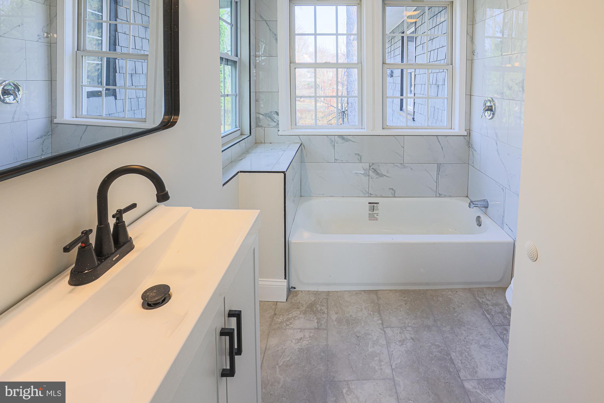 2606 Queen Anne Road Baltimore, MD 21216 - Photo 61 of 92 Bright and airy modern bathroom retreat.