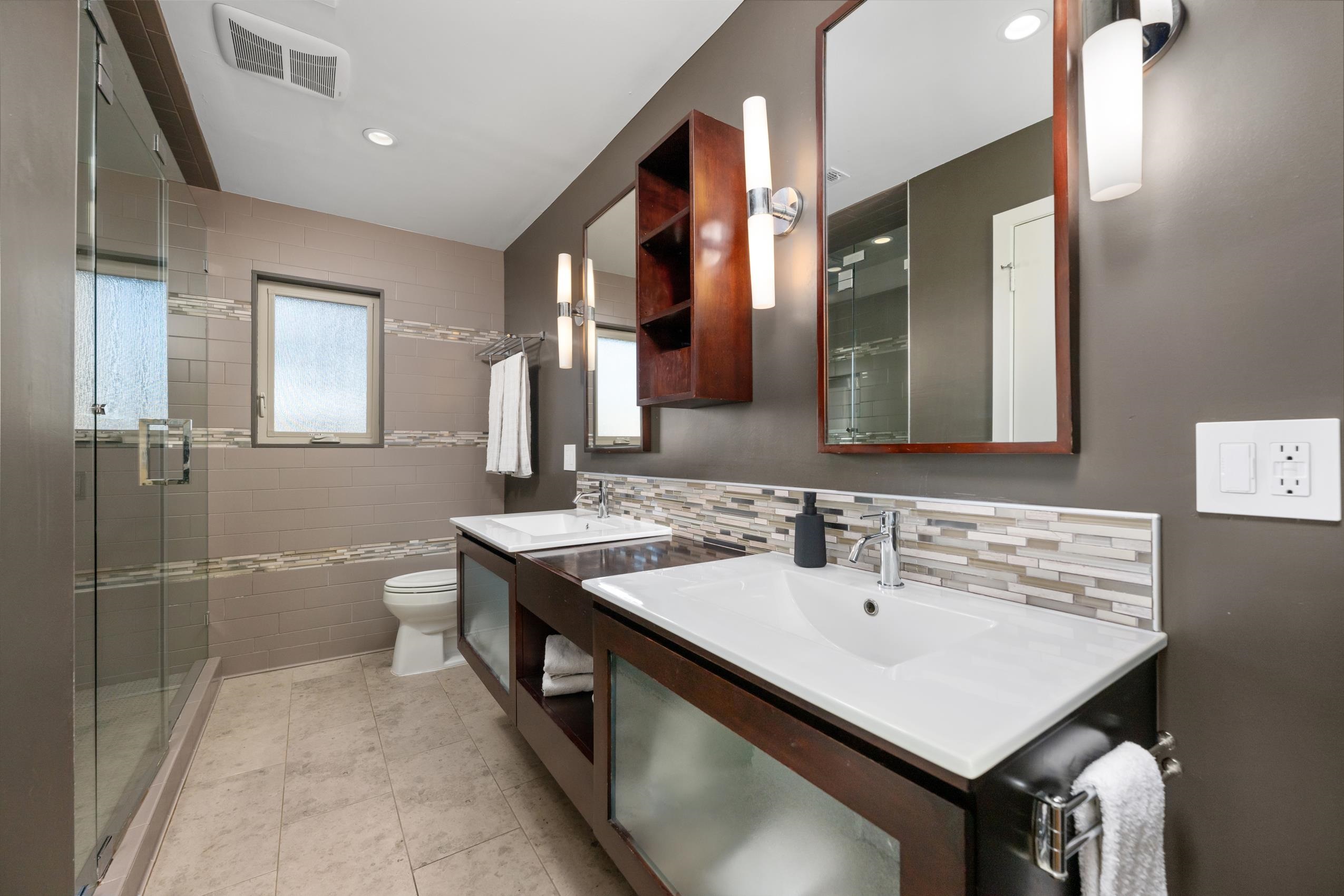 8805 Mountain Ridge Drive Austin, TX 78759 - Photo 17 of 30 a bathroom with a sink and a mirror