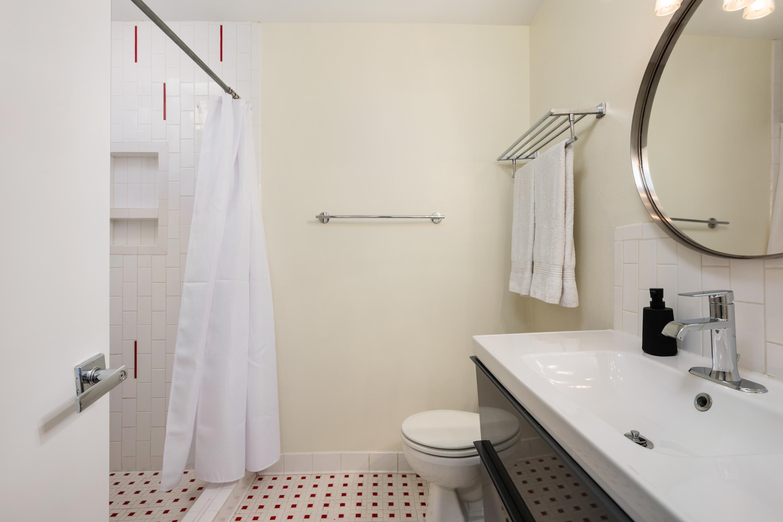 8805 Mountain Ridge Drive Austin, TX 78759 - Photo 20 of 30 a bathroom with a sink toilet and shower