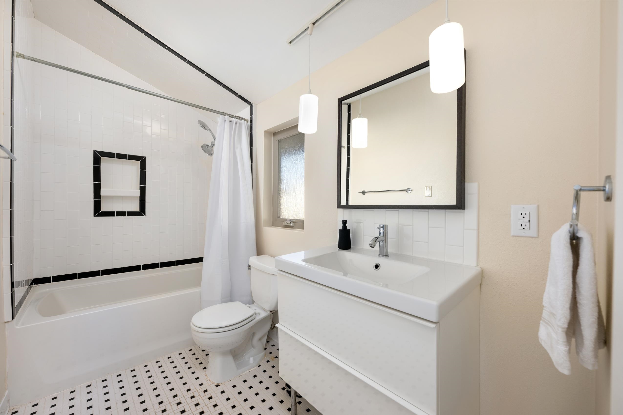 8805 Mountain Ridge Drive Austin, TX 78759 - Photo 22 of 30 a bathroom with a toilet sink and shower