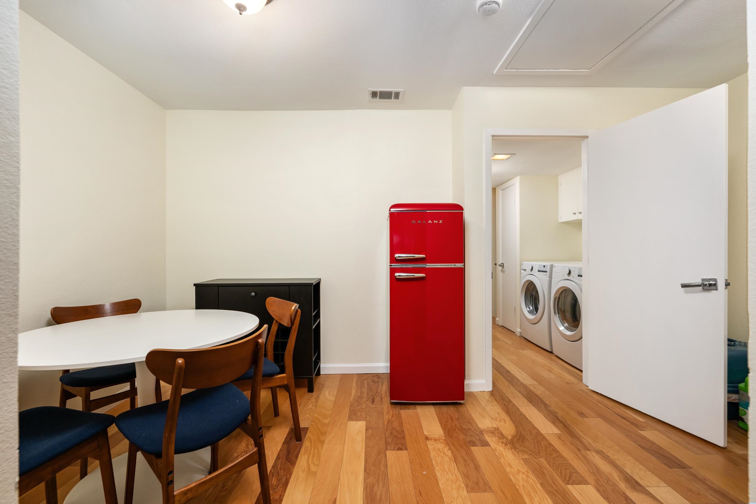 8805 Mountain Ridge Drive Austin, TX 78759 - Photo 23 of 30 a view of a dining room with furniture and wooden floor