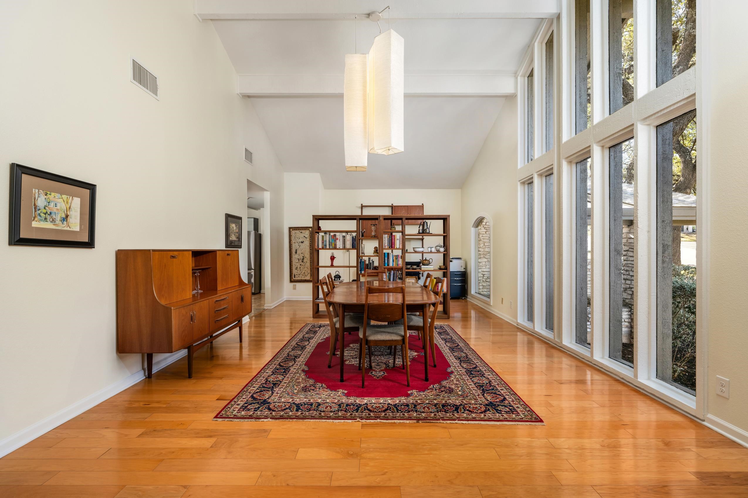 8805 Mountain Ridge Drive Austin, TX 78759 - Photo 3 of 30 a living room with furniture rug and window