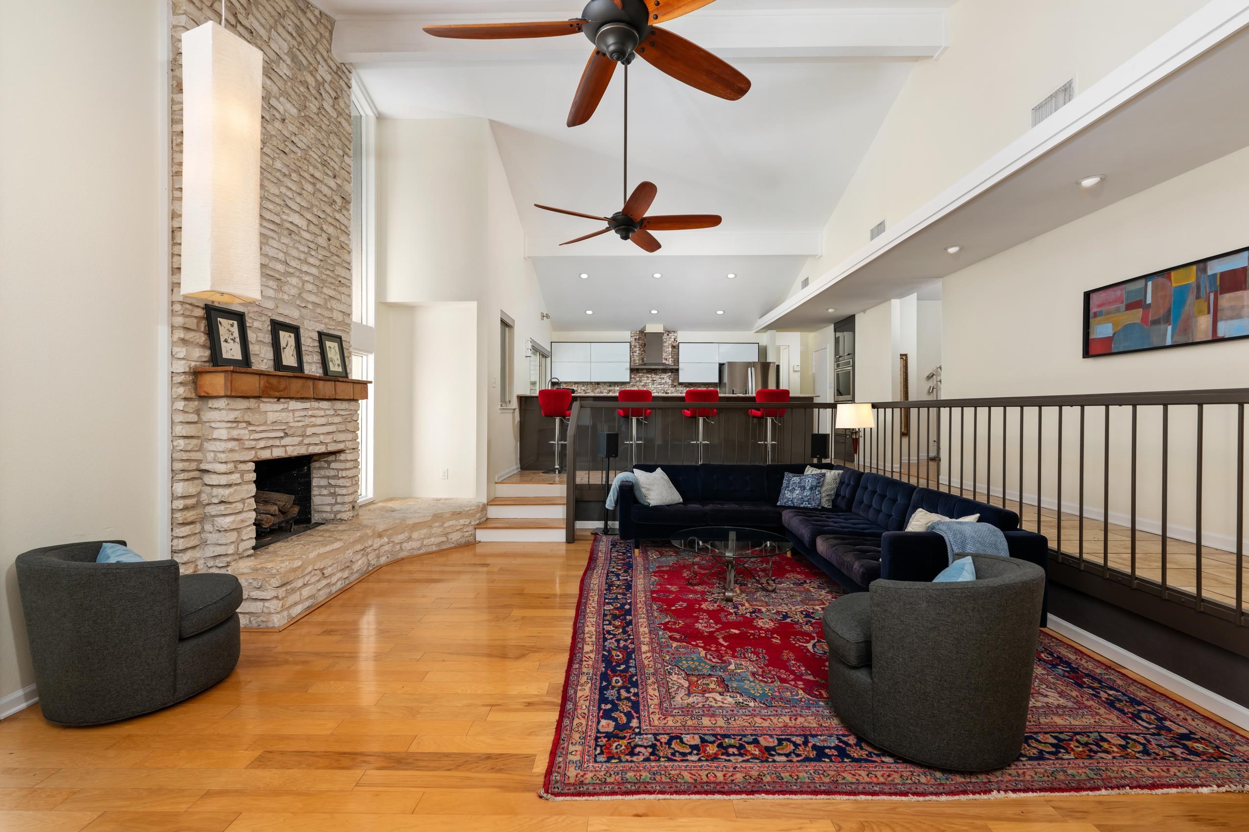 8805 Mountain Ridge Drive Austin, TX 78759 - Photo 6 of 30 a living room with furniture and a fireplace