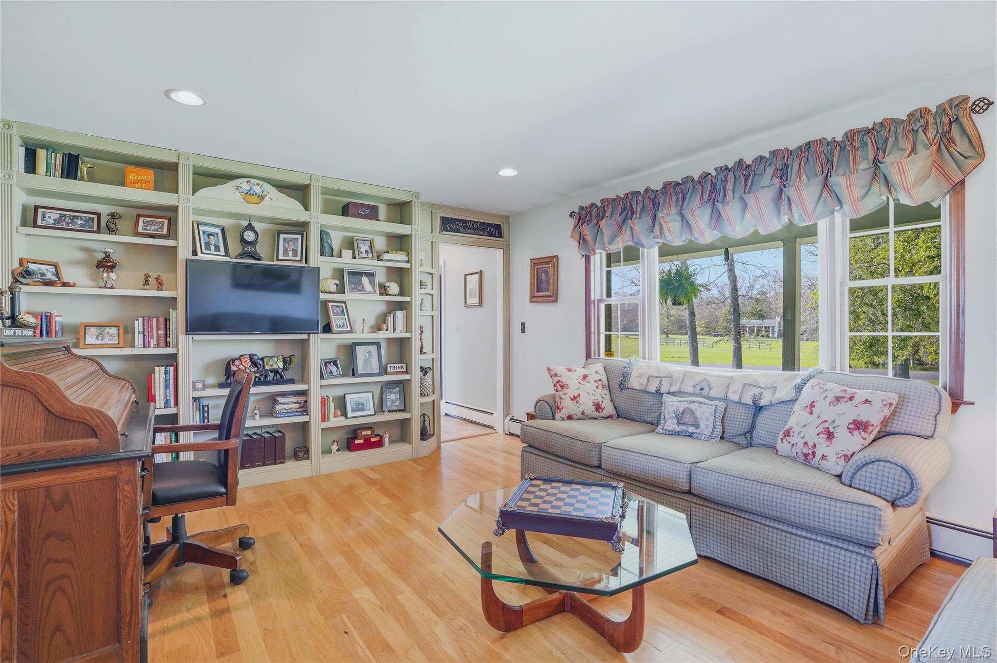 36 River Glen Road Wallkill, NY 12589 - Photo 17 of 47 a living room with furniture cabinets and a large window