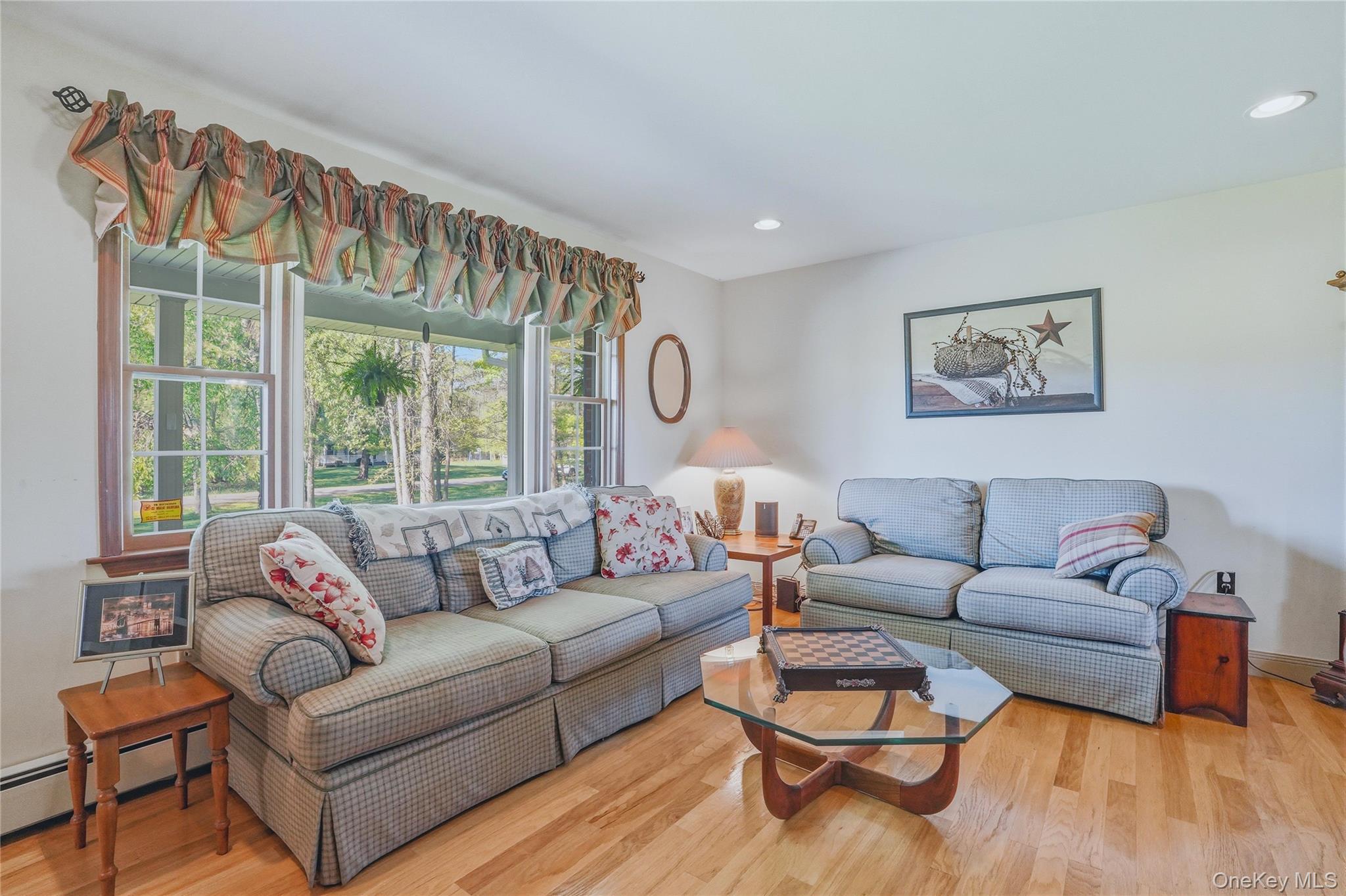36 River Glen Road Wallkill, NY 12589 - Photo 18 of 47 a living room with furniture and a large window