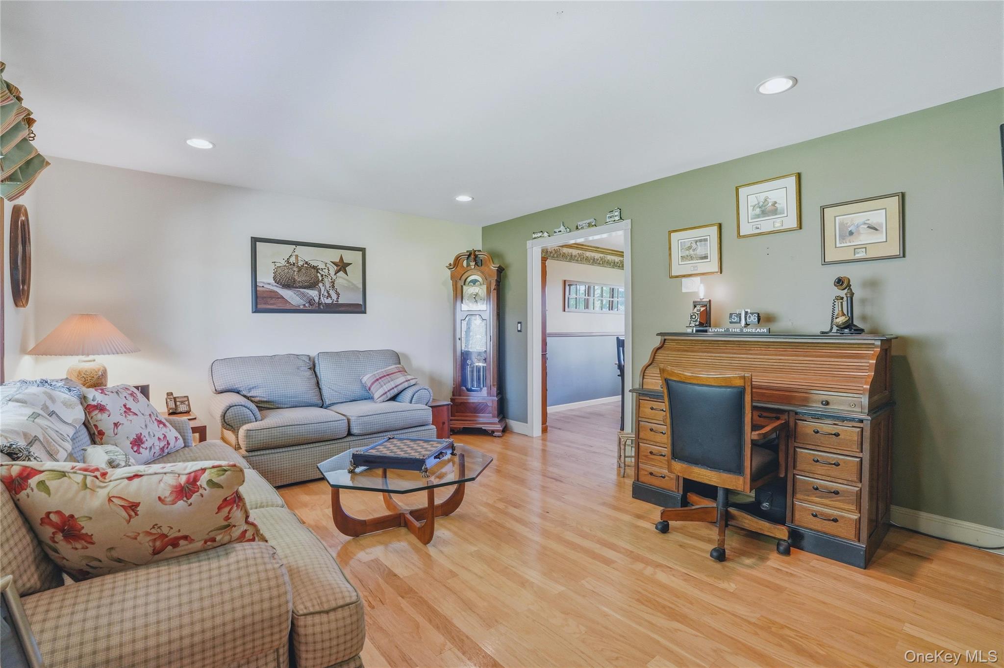 36 River Glen Road Wallkill, NY 12589 - Photo 19 of 47 a living room with furniture and a wooden floor