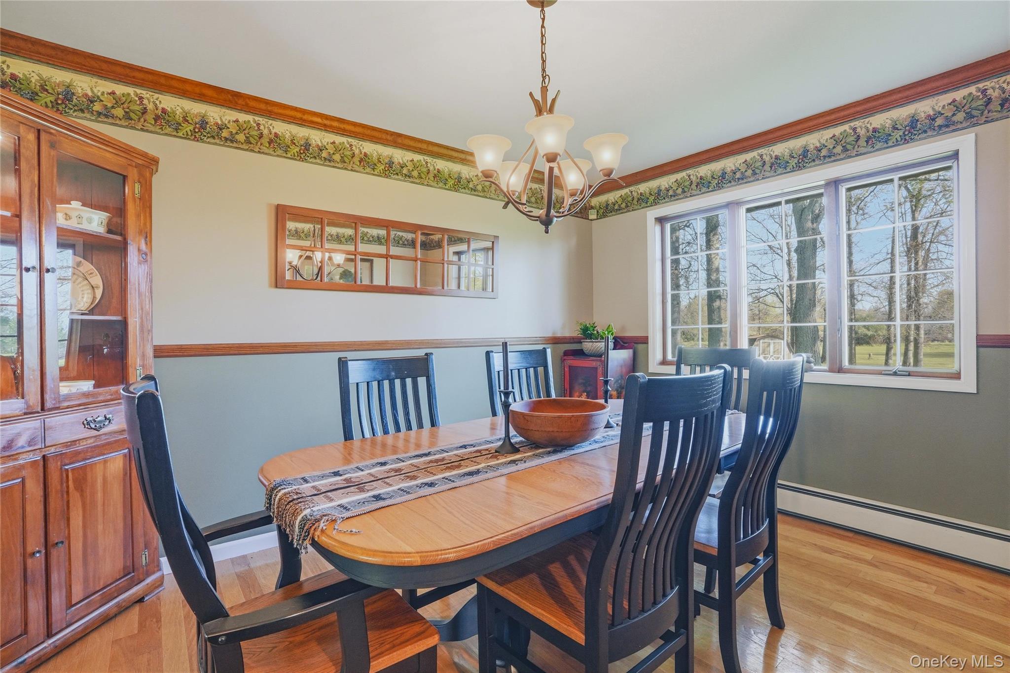 36 River Glen Road Wallkill, NY 12589 - Photo 20 of 47 a view of a dining room with furniture window and wooden floor