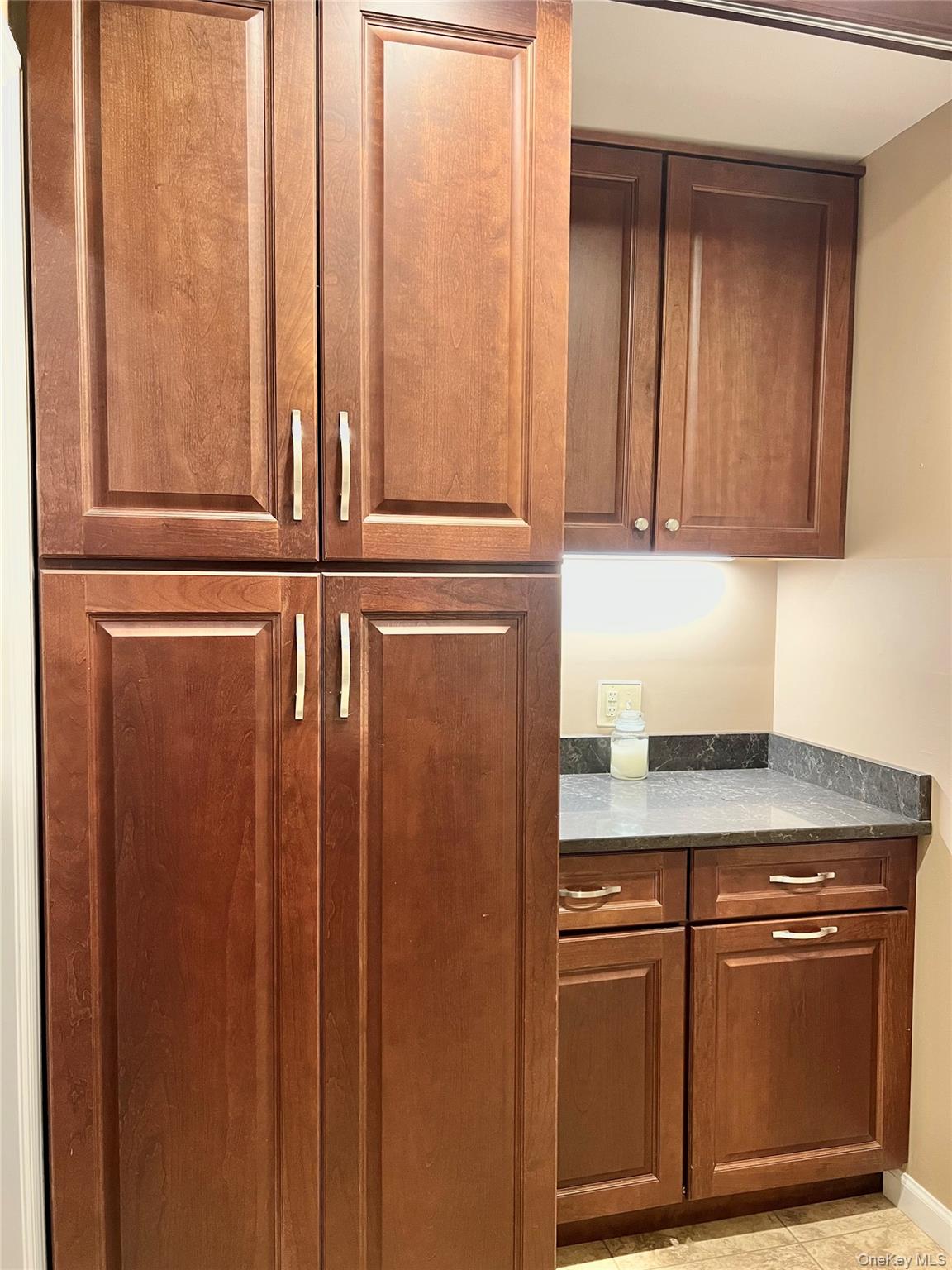 36 River Glen Road Wallkill, NY 12589 - Photo 23 of 47 a kitchen with granite countertop a refrigerator and cabinets