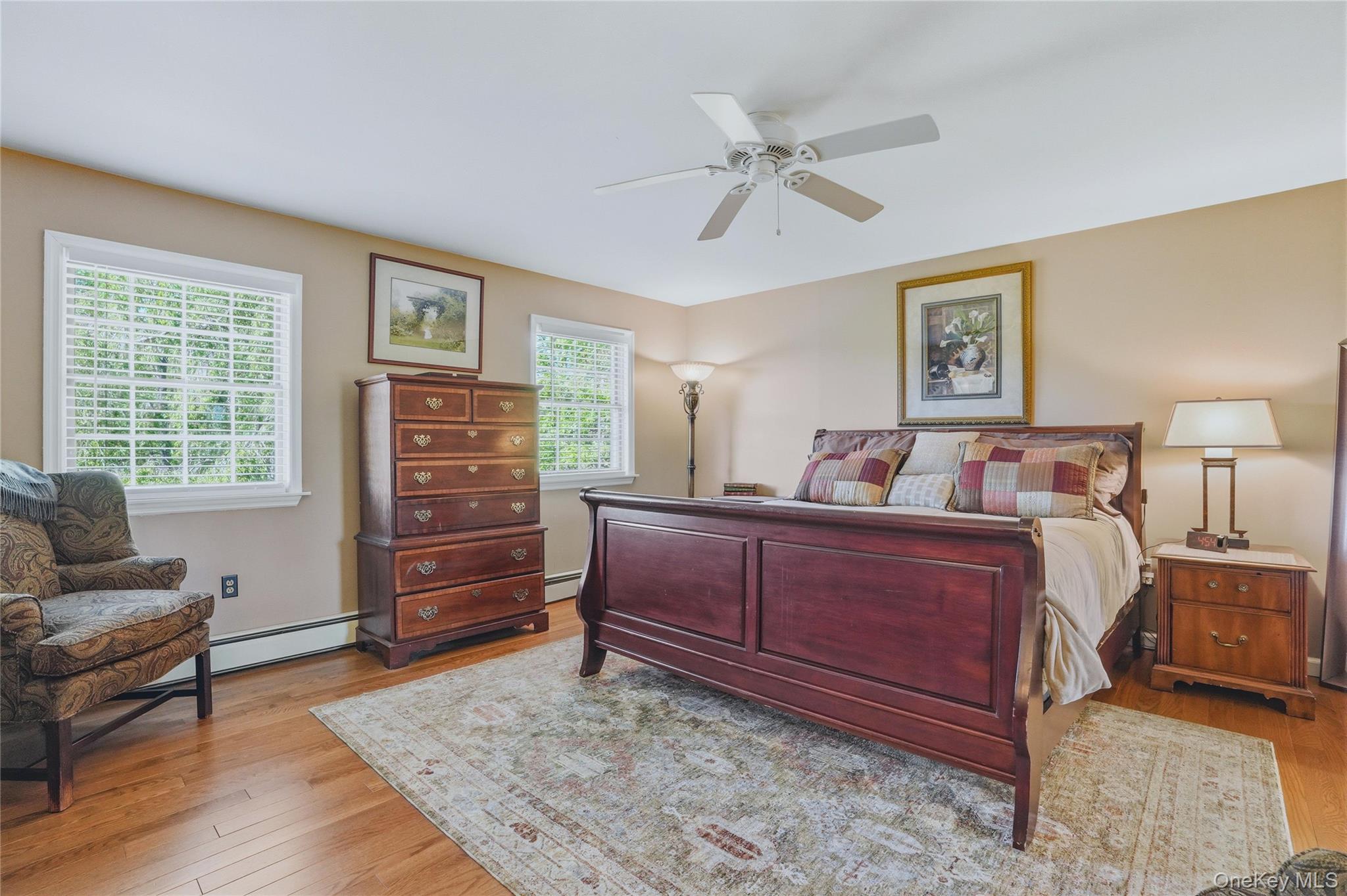 36 River Glen Road Wallkill, NY 12589 - Photo 26 of 47 a bedroom with a bed and wooden floor