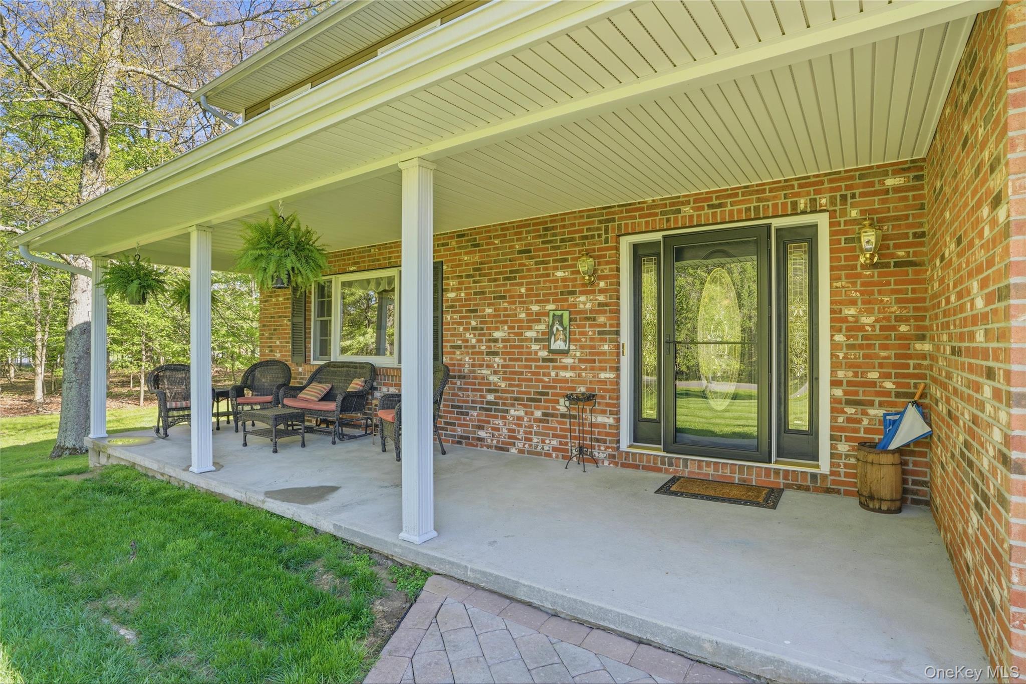 36 River Glen Road Wallkill, NY 12589 - Photo 4 of 47 a view of a porch with chairs and backyard