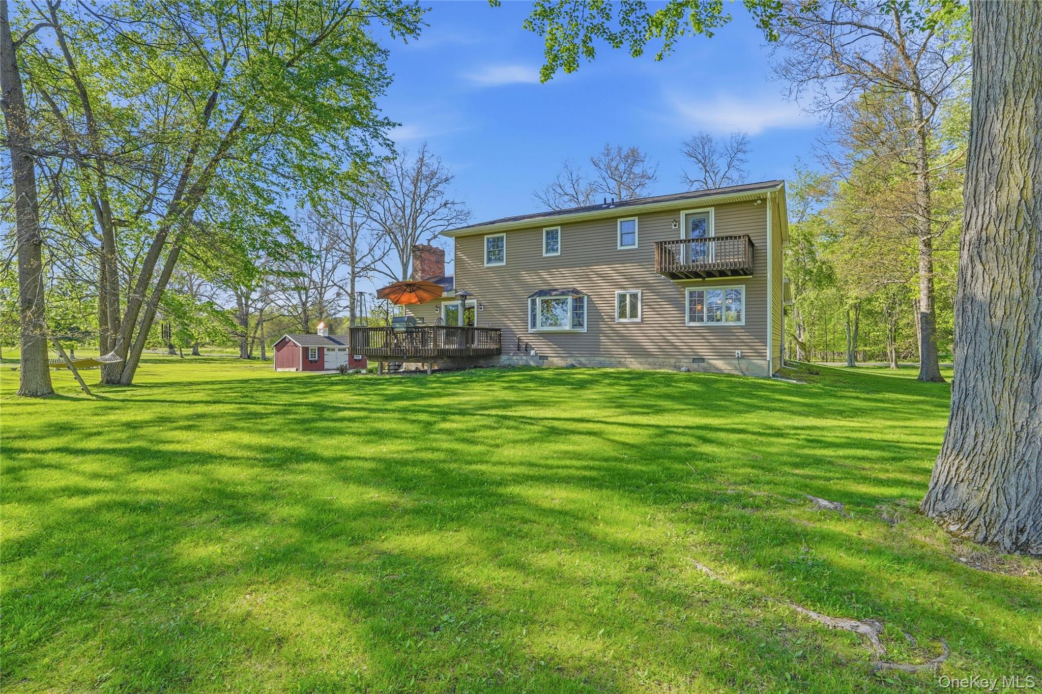 36 River Glen Road Wallkill, NY 12589 - Photo 41 of 47 a front view of house with garden