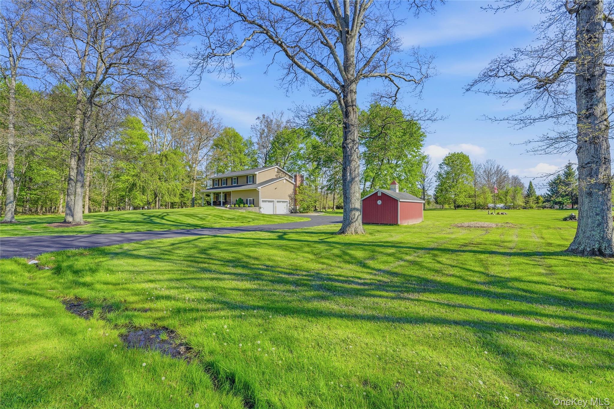 36 River Glen Road Wallkill, NY 12589 - Photo 44 of 47 a front view of a house with a yard