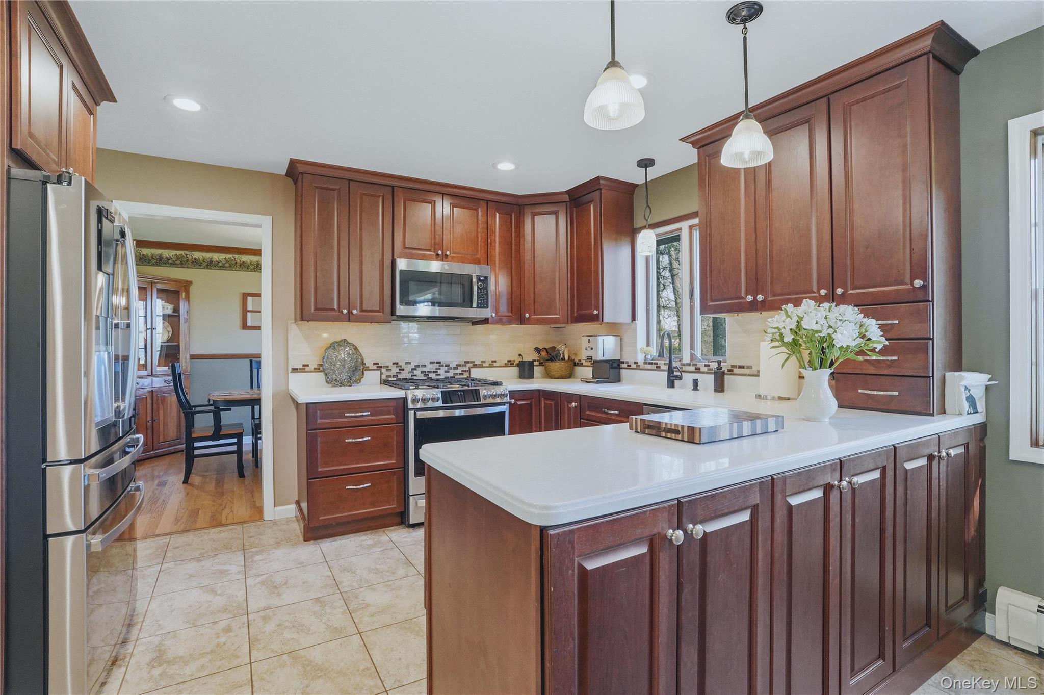 36 River Glen Road Wallkill, NY 12589 - Photo 7 of 47 a kitchen with stainless steel appliances a sink stove and refrigerator