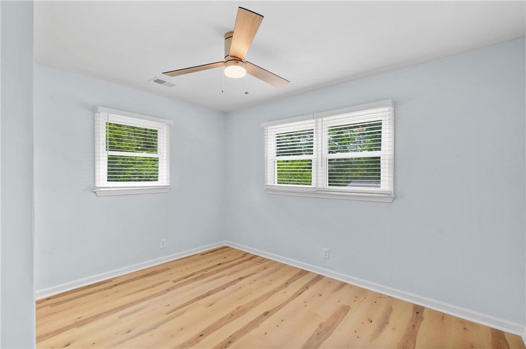 1745 Rockbridge Road Northwest Conyers, GA 30012 - Photo 6 of 32 an empty room with a window