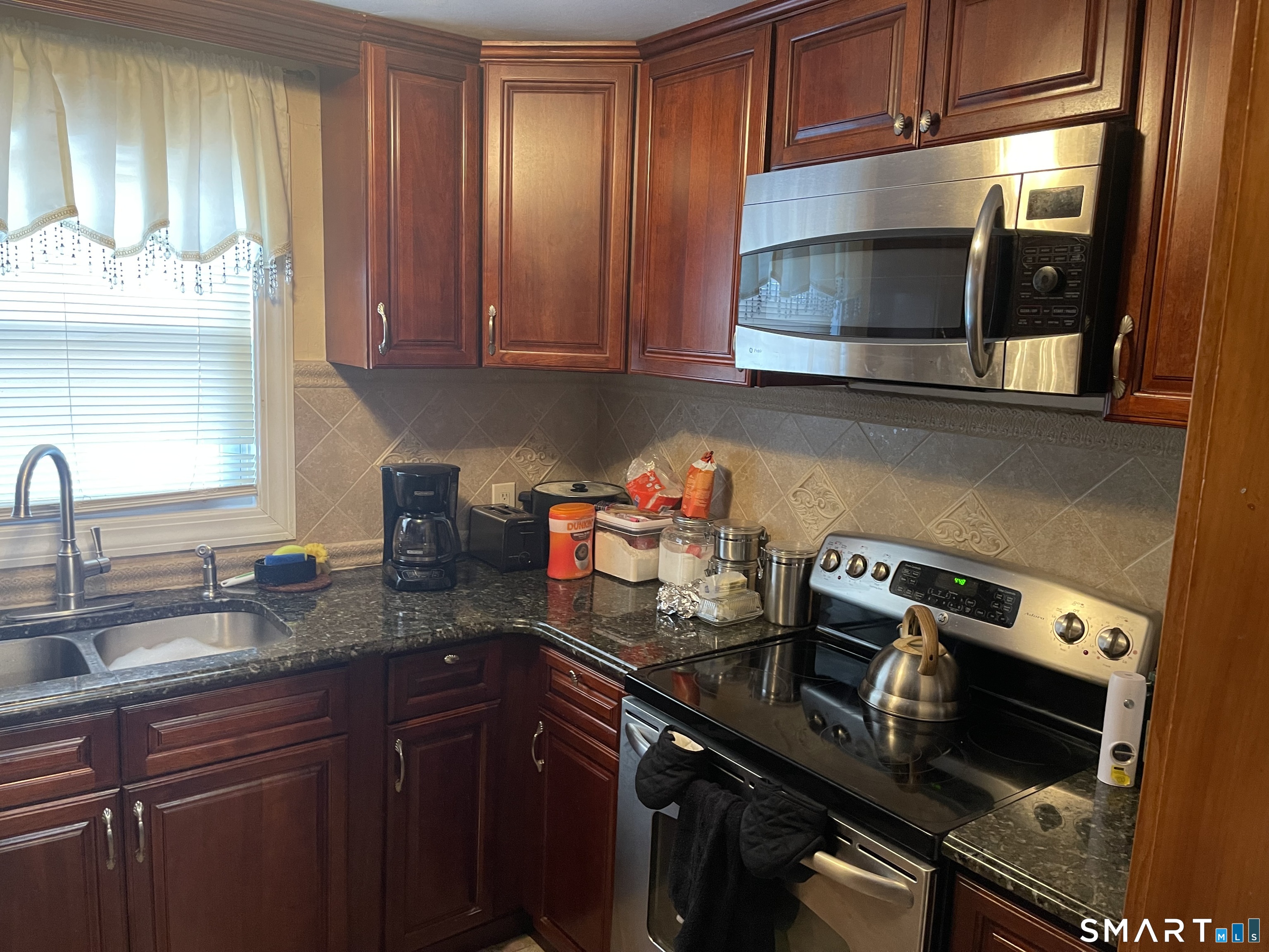 52 Bennett Avenue Waterbury, CT 06708 - Photo 17 of 36 a kitchen with a sink and cabinets
