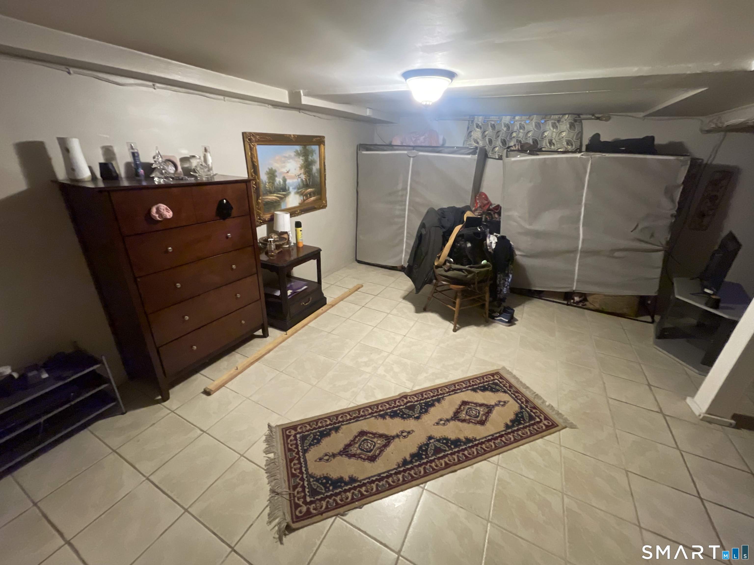 52 Bennett Avenue Waterbury, CT 06708 - Photo 29 of 36 a bed room with a bed and a mirror