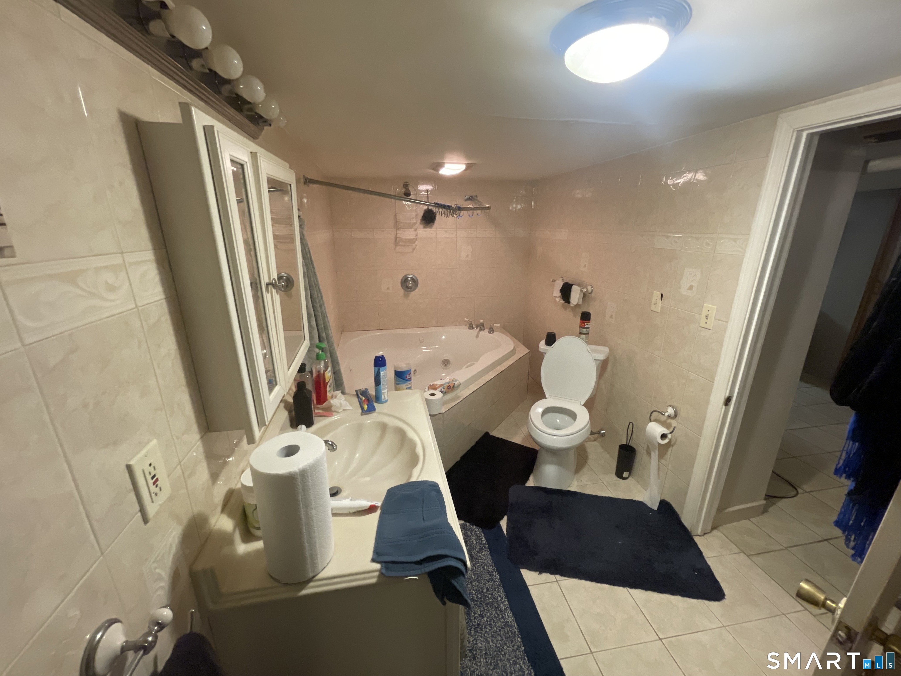 52 Bennett Avenue Waterbury, CT 06708 - Photo 35 of 36 a bathroom with a sink mirror vanity and toilet