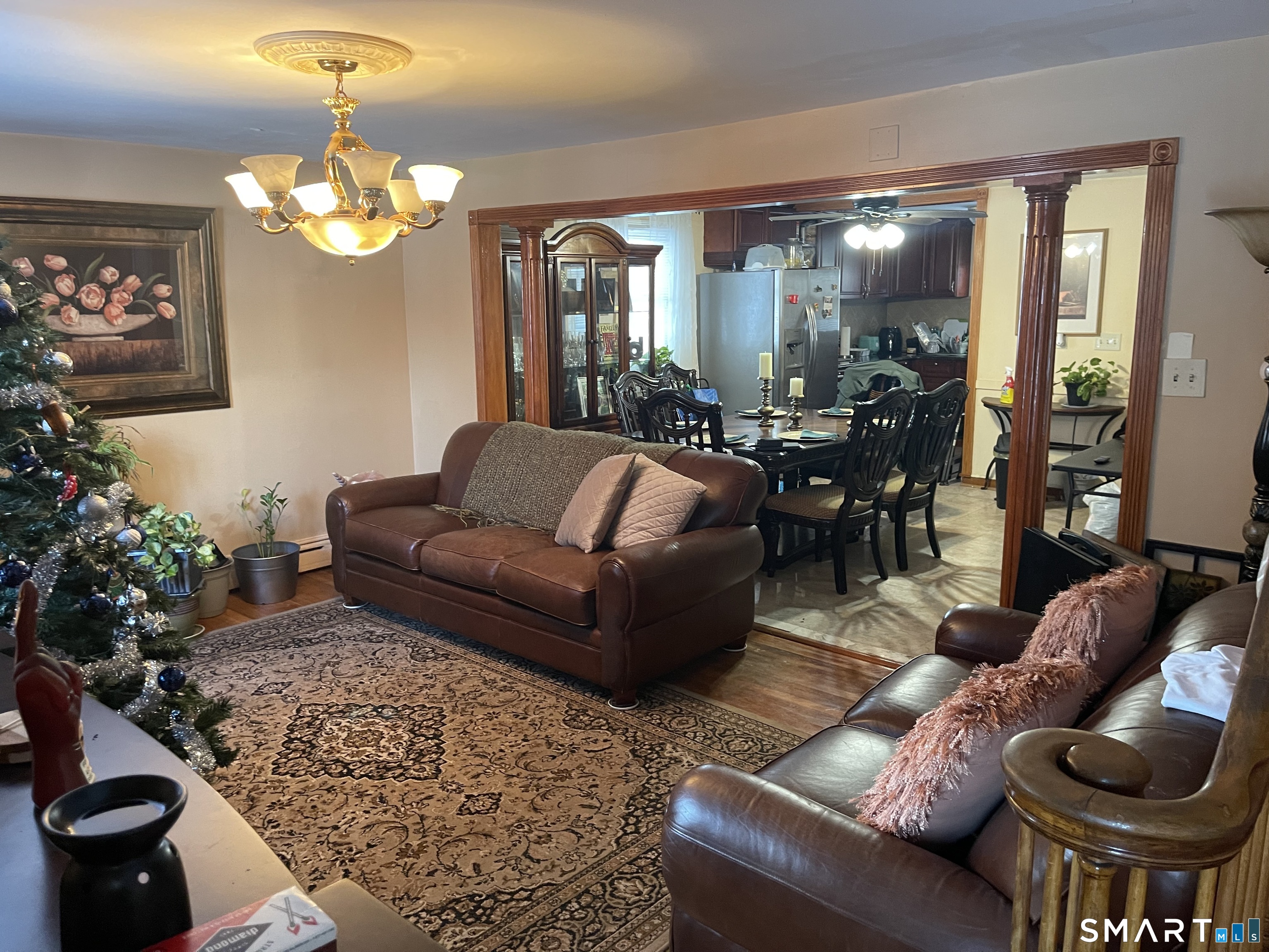 52 Bennett Avenue Waterbury, CT 06708 - Photo 8 of 36 a living room with furniture a chandelier and a couch
