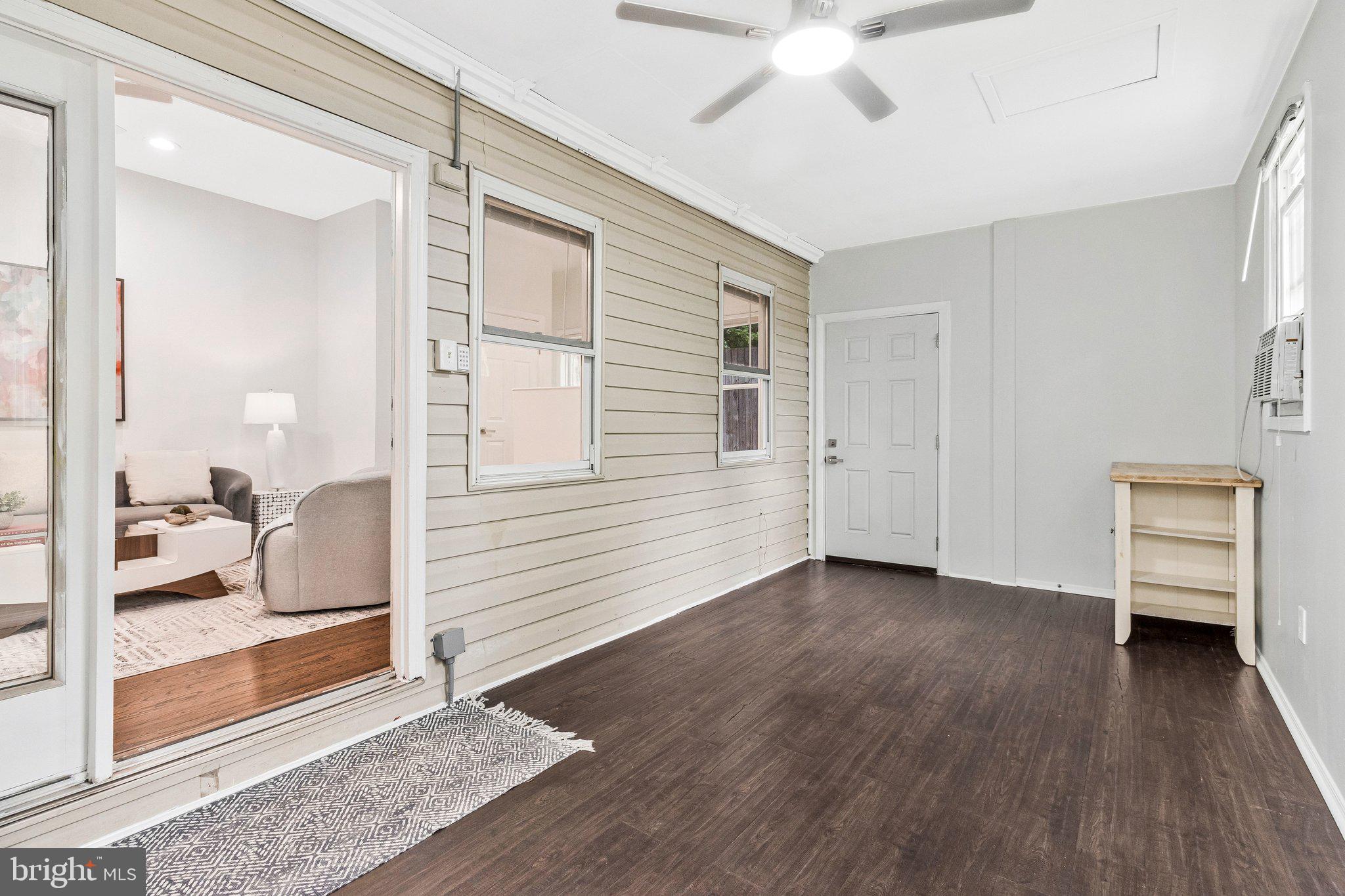 11515 Goodloe Road Silver Spring, MD 20906 - Photo 27 of 33 a view of livingroom with hardwood floor and a ceiling fan