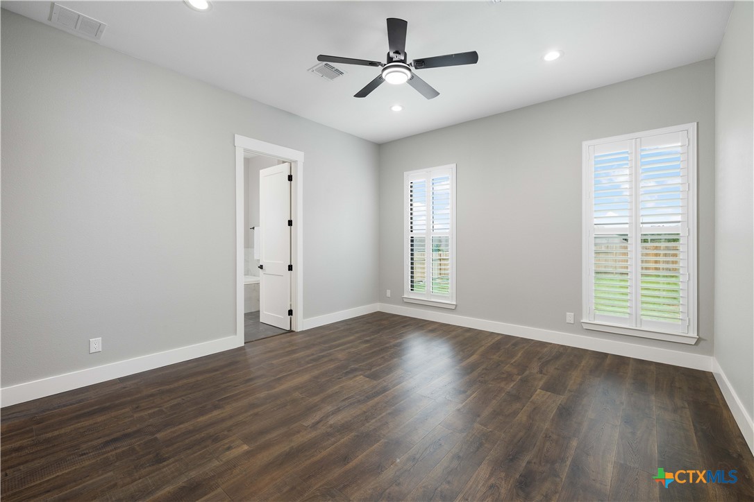 537 Compass Rose Spring Branch, TX 78070 - Photo 13 of 29 a view of an empty room with wooden floor and a window