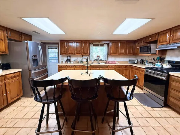 a view of a dining room with furniture and window