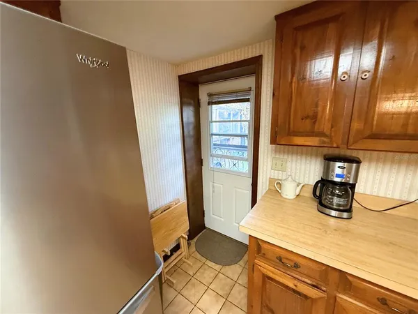 a view of a storage and utility room with washer and dryer