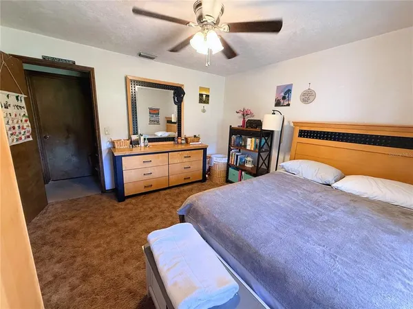 a bed room with a bed and a television