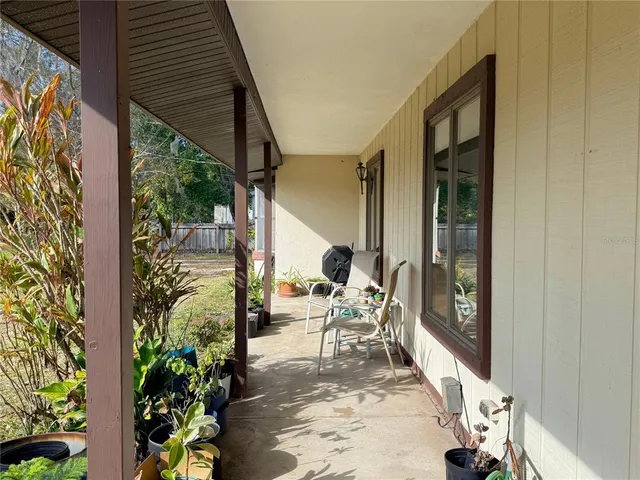 a view of a balcony with chairs