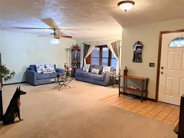 a living room with furniture gym equipment and a view of living room