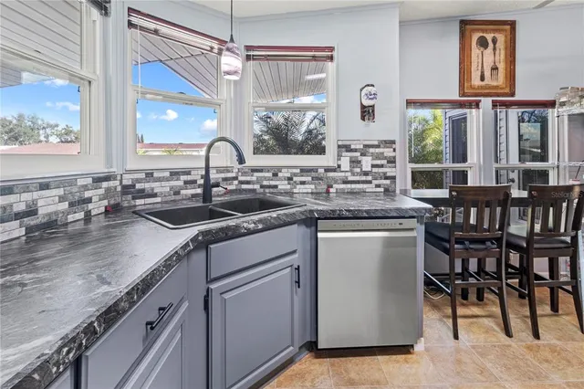 a kitchen with a sink stove and refrigerator