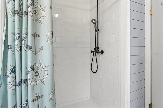 a view of a dining room with furniture large windows and wooden floor