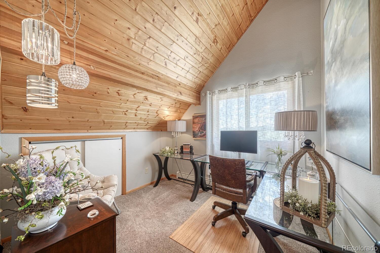 895 Acorn Road Cotopaxi, CO 81223 - Photo 22 of 50 a view of a workspace with furniture and a window