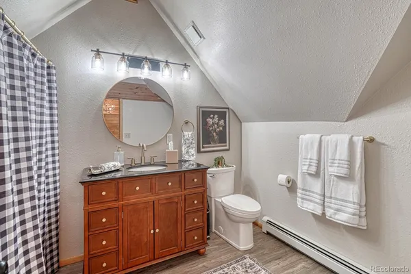 a room with lots of furniture and wooden floor