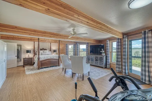a bedroom with a large bed and a couch