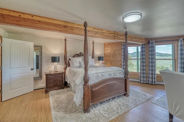 a bed room with a bed and glass door