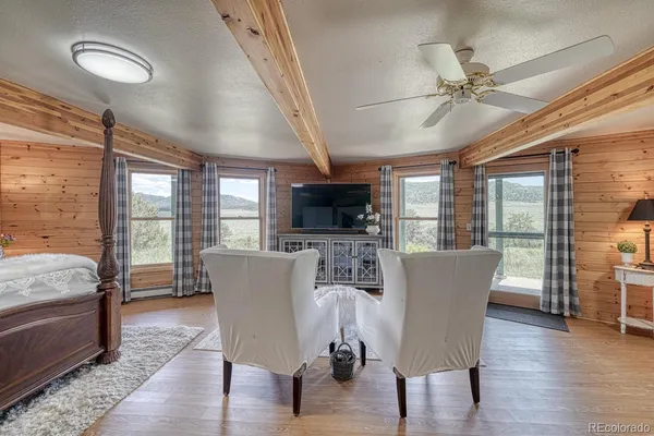 a view of a livingroom with furniture hardwood floor and furniture