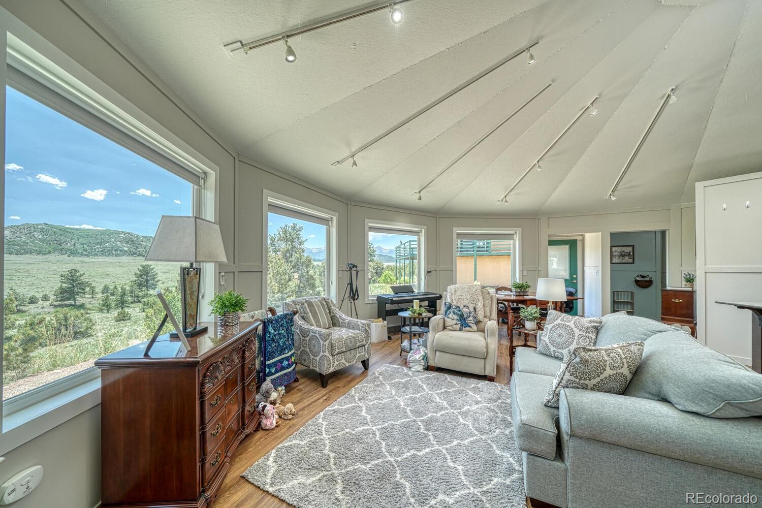 895 Acorn Road Cotopaxi, CO 81223 - Photo 37 of 50 a living room with furniture and a large window