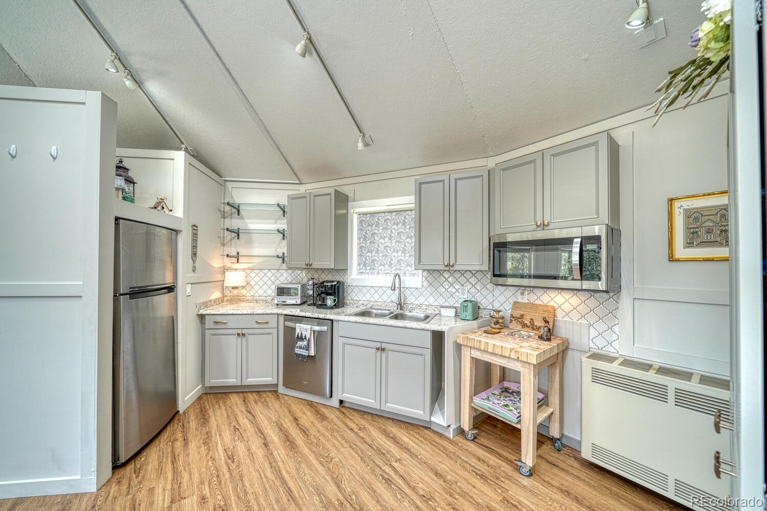 895 Acorn Road Cotopaxi, CO 81223 - Photo 41 of 50 a kitchen with a sink stove and refrigerator