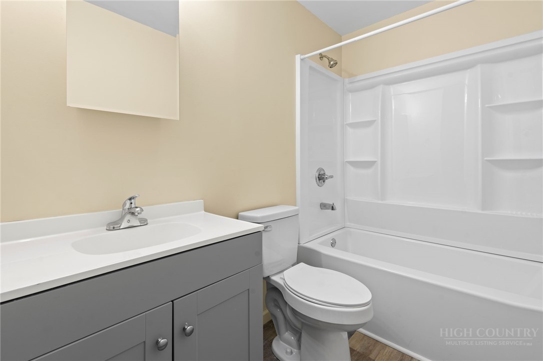 128 Zeb Street, Unit A104 Boone, NC 28607 - Photo 16 of 35 a bathroom with a sink toilet and shower