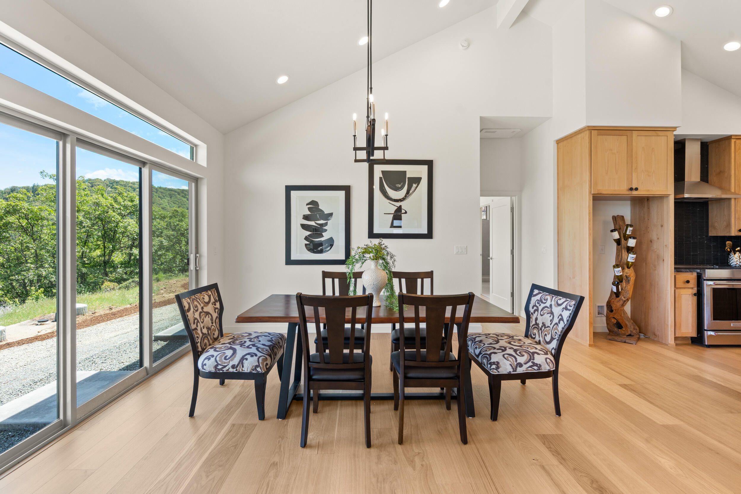 3060 Ashland Mine Road Talent, OR 97540 - Photo 10 of 43 a view of a dining room with furniture window and wooden floor