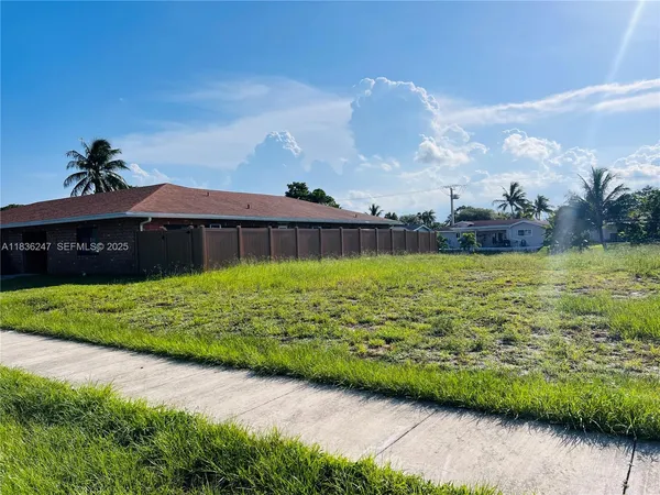 a view of a big yard next to a yard
