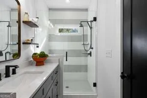 a bathroom with a sink and a shower