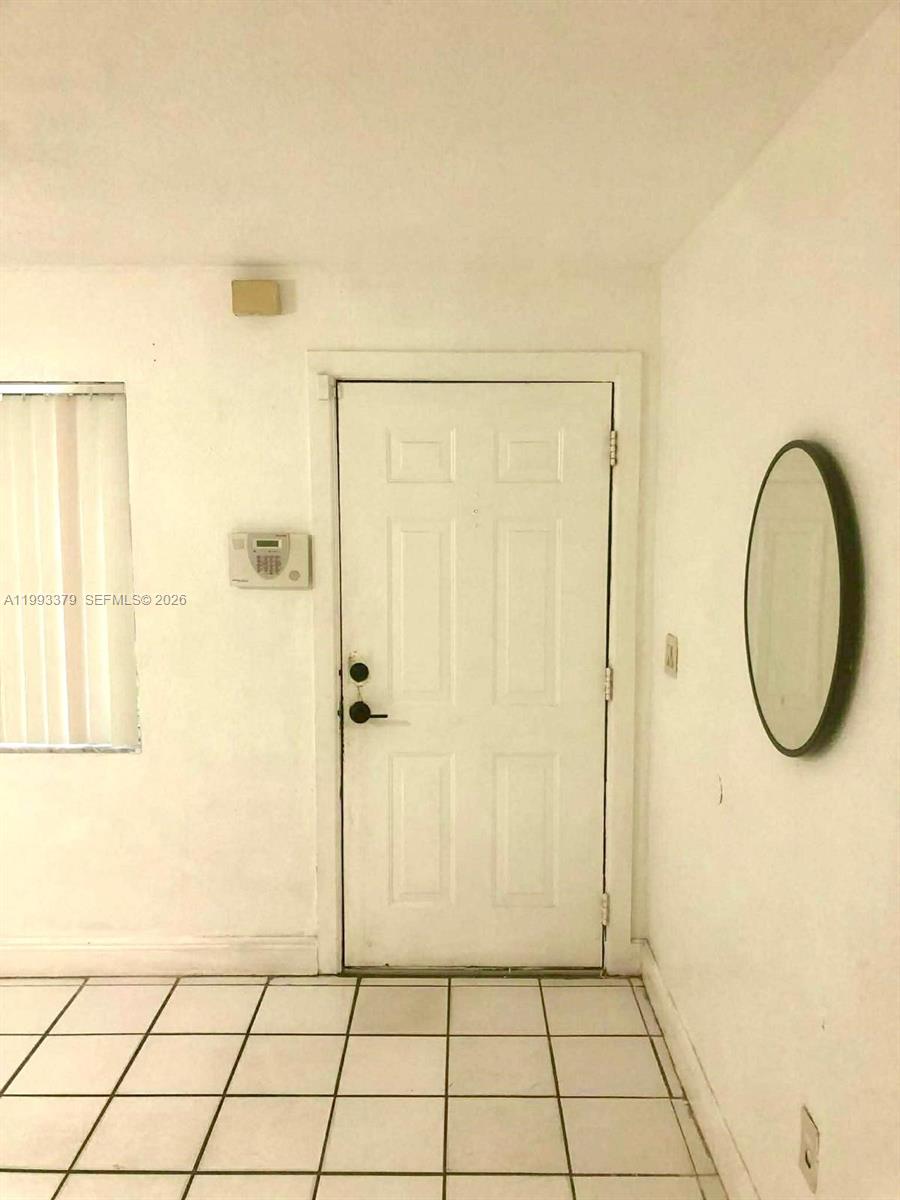 580 Tallulah Road Lake Worth, FL 33462 - Photo 4 of 12 a view of a bathroom with a shower