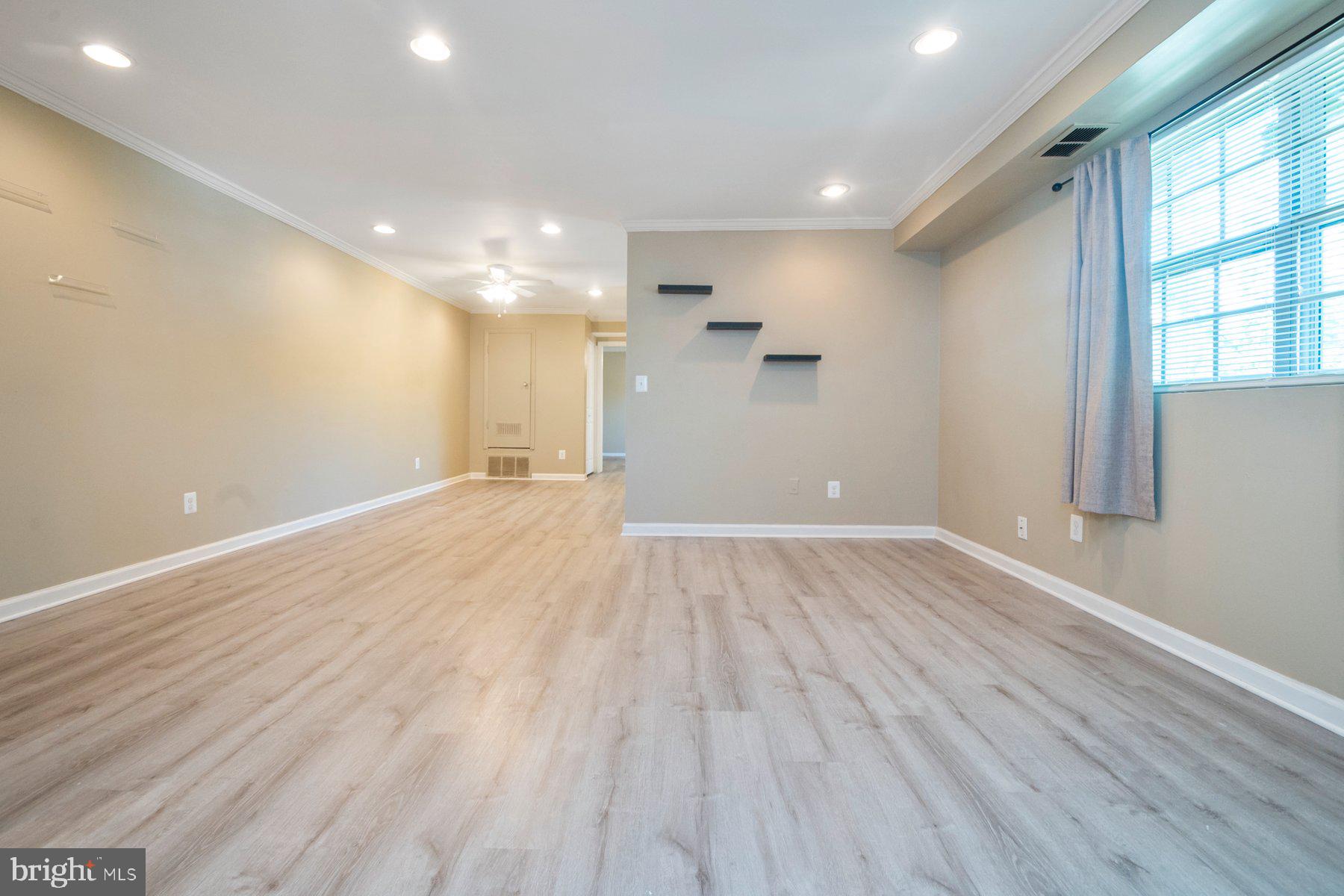 11906 Tarragon Road, Unit H Reisterstown, MD 21136 - Photo 7 of 24 Living room/dining room with ceiling fan