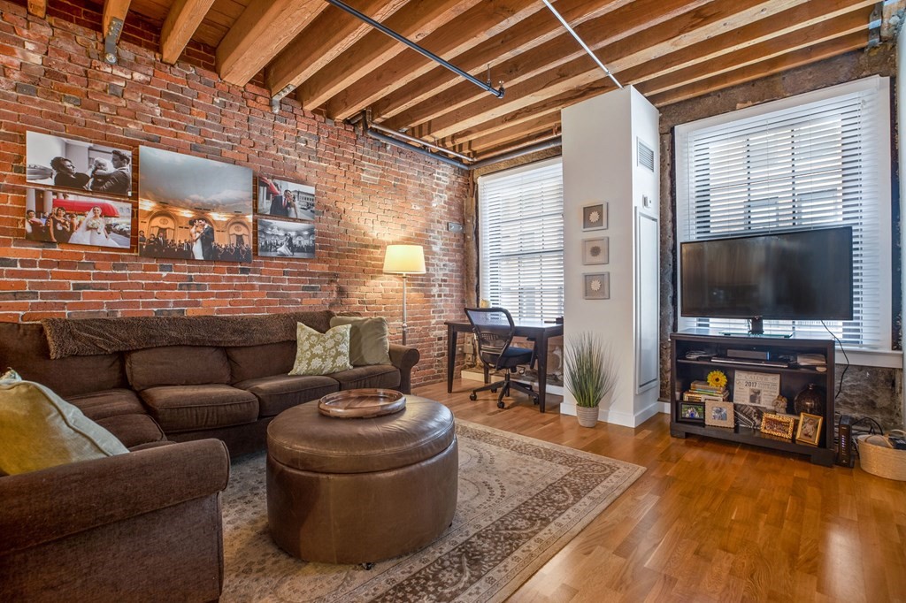 a living room with furniture and a flat screen tv