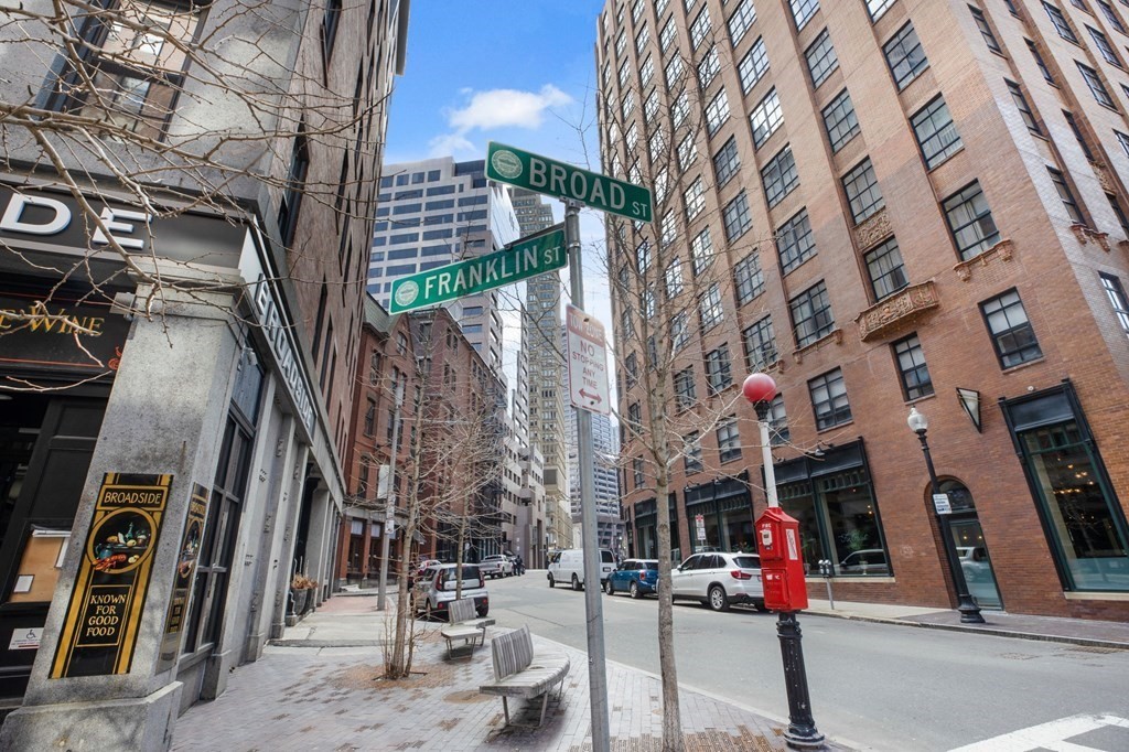 101 Broad Street, Unit 5D Boston, MA 02110 - Photo 10 of 13 a view of a building with traffic signal