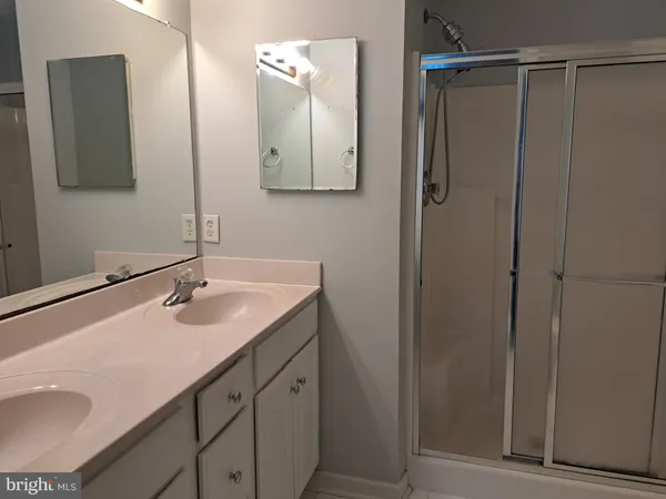 a bathroom with a sink and mirror