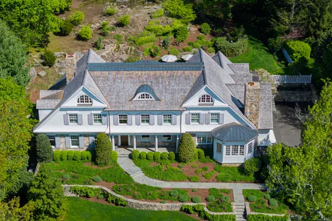 a aerial view of a house with a garden and plants